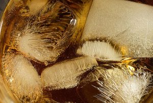 Close-up image of ice in a drink.